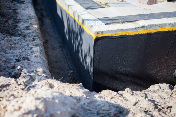 Professional Waterproofing technician working in Troy, PA